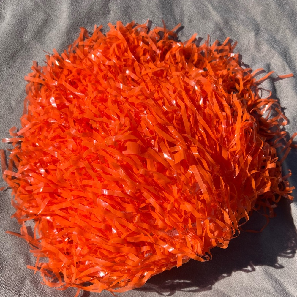 Halloween! Fun tinsel wigs. 1 purple. 1 orange.
